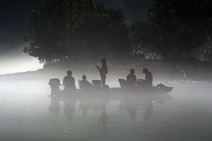 fishermen in a motorboat on an Arkansas lake