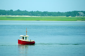 little red boat in Cape Cod Bay