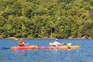 two kayakers kayaking on Canadice Lake in upstate New York