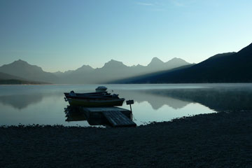 small boats in the morning mist over Lake McDonald, Glacier National Park