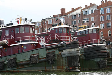 three tugboats at a Portsmouth, New Hampshire dock