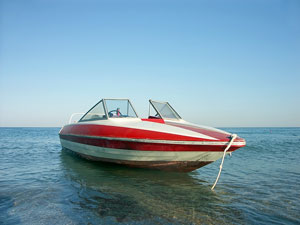 red and white motorboat